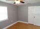 Bedroom featuring hardwood floors, a ceiling fan, and a closet at 1014 Lexington St, Lakeland, FL 33801