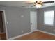 Bedroom featuring hardwood floors, natural light, and neutral paint tones at 1014 Lexington St, Lakeland, FL 33801
