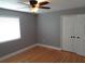 Bedroom with hardwood flooring, ceiling fan, and closet at 1014 Lexington St, Lakeland, FL 33801