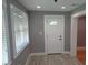 Entryway with gray walls, wood-look tile, and natural light at 1014 Lexington St, Lakeland, FL 33801