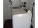 Bright laundry room featuring a clean, white washing machine at 1014 Lexington St, Lakeland, FL 33801