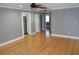 Open living room with hardwood floors and doorways leading to other rooms at 1014 Lexington St, Lakeland, FL 33801