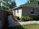 Brick pathway along the side of the home to a fenced backyard at 1014 Lexington St, Lakeland, FL 33801