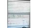 Close up view of a standard window with white blinds at 1014 Lexington St, Lakeland, FL 33801