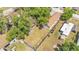 Aerial view showcasing this home with mature trees, large backyard and adjacent properties at 1105 Terry S Ave, Lakeland, FL 33815