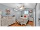 Comfortable bedroom featuring a ceiling fan and wood-look flooring at 1105 Terry S Ave, Lakeland, FL 33815