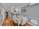 Comfortable dining area featuring hardwood floors, neutral walls, and a view into the living area at 1105 Terry S Ave, Lakeland, FL 33815