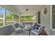 Cozy front porch with cushioned seating, outdoor rug, and decorative accents, offering a relaxing space at 1105 Terry S Ave, Lakeland, FL 33815