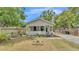 Charming home with covered porch, lush lawn, flower beds, and inviting curb appeal at 1105 Terry S Ave, Lakeland, FL 33815