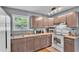 Updated kitchen featuring modern appliances and light-colored countertops at 1105 Terry S Ave, Lakeland, FL 33815