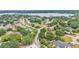 An aerial view of a home in a neighborhood near a lake at 1205 Scottsland Dr, Lakeland, FL 33813