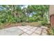 Lush backyard featuring verdant tropical landscaping with open lawn at 1205 Scottsland Dr, Lakeland, FL 33813