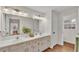 Bathroom featuring a double vanity, updated fixtures, and ample counter space at 1205 Scottsland Dr, Lakeland, FL 33813