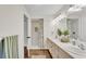 Bathroom featuring a double vanity, updated fixtures, and a stand up shower at 1205 Scottsland Dr, Lakeland, FL 33813