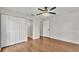 Bedroom with laminate flooring and white closet doors at 1205 Scottsland Dr, Lakeland, FL 33813