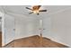 A bright bedroom with laminate flooring and white doors at 1205 Scottsland Dr, Lakeland, FL 33813