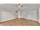 Bright bedroom with a ceiling fan, two closets, and ample natural light at 1205 Scottsland Dr, Lakeland, FL 33813