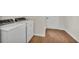 Laundry area with laminate flooring and a washer and dryer at 1205 Scottsland Dr, Lakeland, FL 33813
