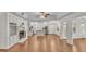 Spacious living room featuring a fireplace, hardwood floors and open layout to the kitchen at 1205 Scottsland Dr, Lakeland, FL 33813