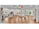 An open-concept design shows the hardwood flooring flowing from the kitchen into the Gathering room at 1205 Scottsland Dr, Lakeland, FL 33813