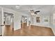 Open-concept living room with multiple access points and wood floors at 1205 Scottsland Dr, Lakeland, FL 33813