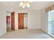 Bright bedroom with neutral wall paint, a closet, and ceiling fan at 1407 Easton Dr, Lakeland, FL 33803