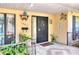 Welcoming front porch with decorative details, potted plants, and a secure entrance at 1407 Easton Dr, Lakeland, FL 33803
