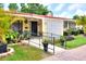 Charming home with vibrant landscaping, decorative accents, and a welcoming front entrance at 1407 Easton Dr, Lakeland, FL 33803