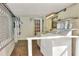 The covered laundry area features a sink, storage shelving, and washer and dryer at 1407 Easton Dr, Lakeland, FL 33803