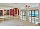 Spacious living room with tile flooring, mirrored walls, and ample natural light at 1407 Easton Dr, Lakeland, FL 33803