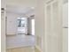 Open floor plan with access to a bright living area and hallway with neutral color palette at 1407 Easton Dr, Lakeland, FL 33803