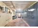 Finished storage area next to the pool features cabinets, AC unit and exterior access at 1407 Easton Dr, Lakeland, FL 33803