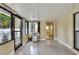 Bright sunroom featuring expansive windows offering views of the surrounding area and neutral flooring at 1407 Easton Dr, Lakeland, FL 33803