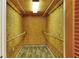 Expansive walk-in closet with wooden rods, and custom shelving for organized storage solutions at 1407 Easton Dr, Lakeland, FL 33803