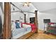 Spacious bedroom featuring a wooden four-poster bed and ceiling fan at 1573 Avleigh Cir, Orlando, FL 32824