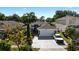 Beautiful home features a two-car garage, manicured landscaping, and a well-maintained lawn at 1573 Avleigh Cir, Orlando, FL 32824