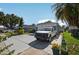 Home exterior featuring an attached garage and long driveway with plenty of parking at 1573 Avleigh Cir, Orlando, FL 32824