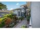 Inviting front entrance featuring a landscaped walkway and charming curb appeal at 1573 Avleigh Cir, Orlando, FL 32824