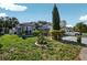 Beautiful front yard with green grass and mature landscaping at 1573 Avleigh Cir, Orlando, FL 32824