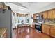 Kitchen featuring tile floors, wooden cabinets, and stainless steel appliances at 1573 Avleigh Cir, Orlando, FL 32824