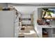Functional kitchen and living space features tile floors, white appliances, and a view to the backyard at 1573 Avleigh Cir, Orlando, FL 32824
