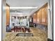 Granite countertops, wood cabinets, and stainless-steel appliances highlight this kitchen's elegance and functionality at 1573 Avleigh Cir, Orlando, FL 32824