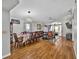 Open-concept living and dining area with hardwood floors and plenty of natural light at 1573 Avleigh Cir, Orlando, FL 32824