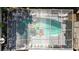 Aerial view of a screened-in pool area with surrounding patio and lounge furniture at 1573 Avleigh Cir, Orlando, FL 32824