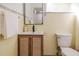 This bathroom has cream-colored tiles and a stylish vanity with a black faucet at 1604 Sylvester Rd, Lakeland, FL 33803