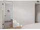 This is a peek into a bathroom with vertical white tiles and black and white floor tiles at 1604 Sylvester Rd, Lakeland, FL 33803