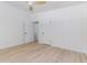 This bedroom is brightly lit with neutral walls and wood-look floors at 1604 Sylvester Rd, Lakeland, FL 33803