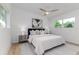 Serene bedroom with a plush bed, stylish decor, and ample natural light at 1604 Sylvester Rd, Lakeland, FL 33803
