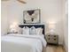 Beautiful bedroom featuring a comfortable queen-sized bed and stylish decor, and soft lighting at 1604 Sylvester Rd, Lakeland, FL 33803