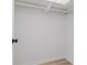Walk-in closet with ample shelving for storage and organization in an open concept space at 1604 Sylvester Rd, Lakeland, FL 33803